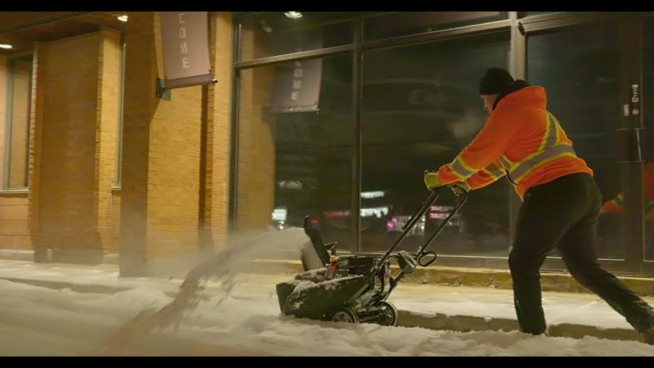 Black Swan Landscaping crew using advanced snow blowers to tackle snowstorms on a Caledon, Ontario, commercial property.